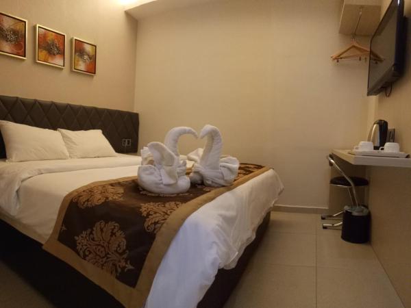 Golden Leaves Hotel : photo 1 de la chambre chambre lit queen-size