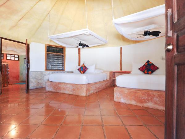 Zamas Hotel : photo 2 de la chambre chambr avec jardin - vue partielle sur mer