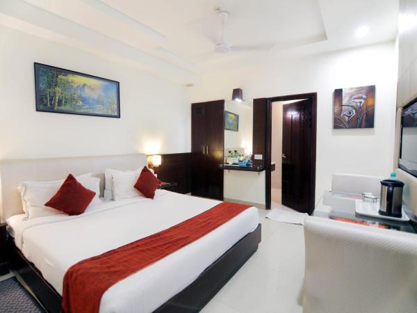 Taj Inn Hotel : photo 2 de la chambre chambre deluxe double ou lits jumeaux