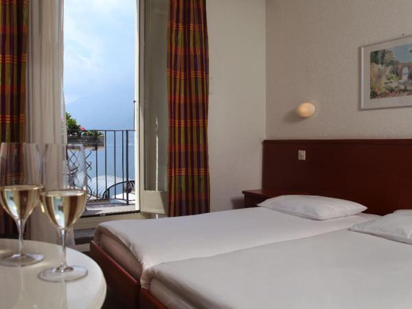 Piazza Ascona Hotel & Restaurants : photo 2 de la chambre chambre lits jumeaux avec balcon et vue sur le lac
