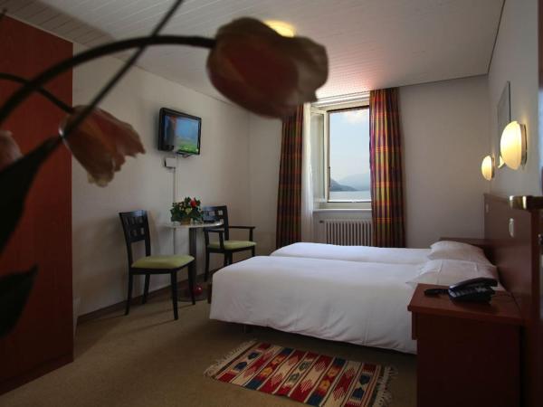 Piazza Ascona Hotel & Restaurants : photo 1 de la chambre chambre lits jumeaux - vue sur lac