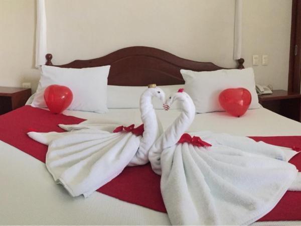 Villas Coco Resort - All Suites : photo 7 de la chambre suite lit king-size avec baignoire spa