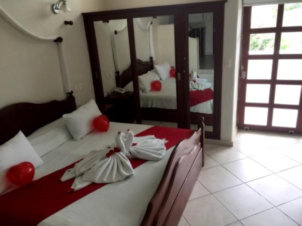 Villas Coco Resort - All Suites : photo 6 de la chambre suite lit king-size avec baignoire spa