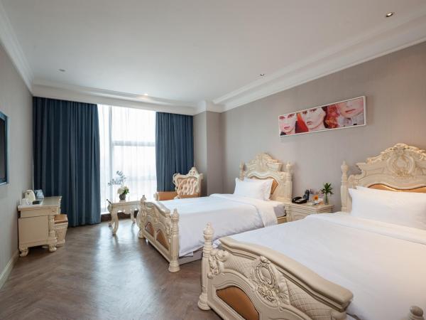 Nan Yang Royal Hotel : photo 4 de la chambre chambre lits jumeaux deluxe avec vue sur le jardin