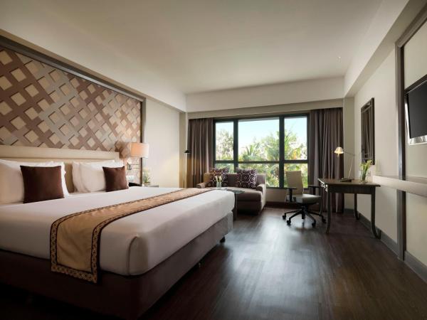 Melia Purosani Yogyakarta : photo 1 de la chambre chambre double ou lits jumeaux deluxe - vue sur piscine