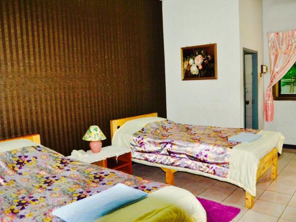 Wiang Inn Mansion : photo 2 de la chambre chambre lits jumeaux avec balcon