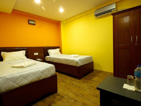 Everest Holiday Inn : photo 1 de la chambre chambre deluxe double ou lits jumeaux
