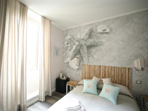 Echi del Mare : photo 10 de la chambre chambre deluxe double ou lits jumeaux