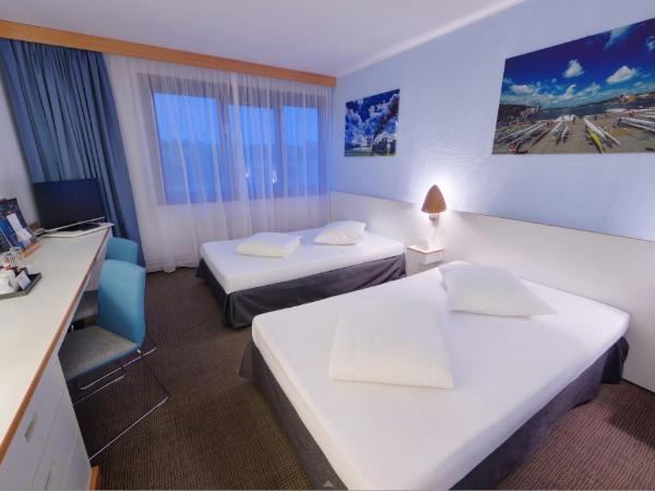 Novotel Poznań Malta : photo 1 de la chambre chambre lits jumeaux