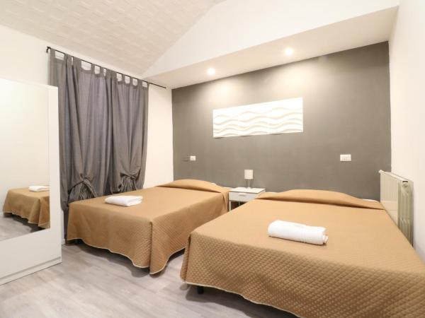 Guest House Minas : photo 1 de la chambre chambre quadruple avec salle de bains privative