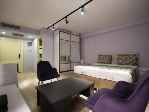 EPS Suite : photo 3 de la chambre chambre lit king-size avec balcon