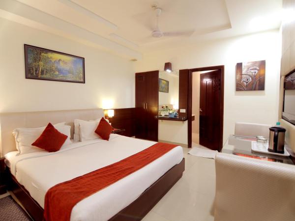 Taj Inn Hotel : photo 7 de la chambre chambre deluxe double ou lits jumeaux