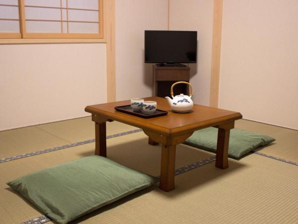 Kamoya Ryokan : photo 1 de la chambre chambre familiale