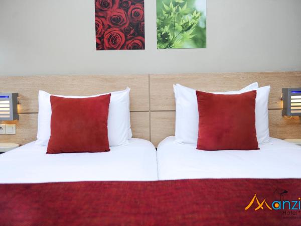 Manzil Hotel : photo 6 de la chambre chambre lits jumeaux