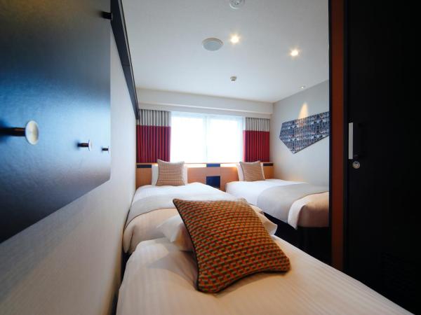 Kyoto Tower Hotel Annex : photo 1 de la chambre chambre lits jumeaux avec lit d'appoint - non-fumeurs