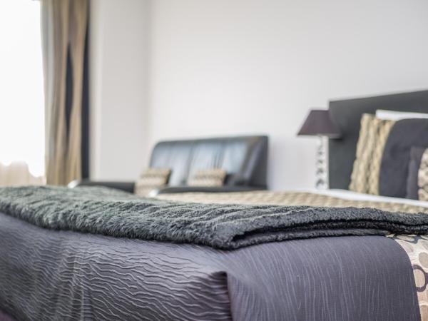 Bellano Motel Suites : photo 4 de la chambre studio supérieur avec baignoire spa