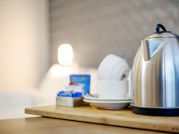 Sidra Pristine Hotel and Portico Halls : photo 7 de la chambre chambre familiale avec balcon