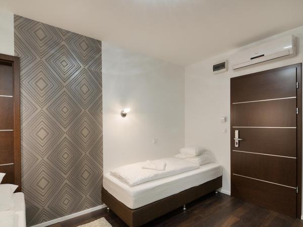 Paulay Downtown Apartments : photo 4 de la chambre chambre lits jumeaux standard