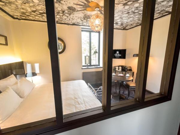 Le Pavillon du Golf d'Arras : photo 5 de la chambre chambre lit king-size - vue sur jardin