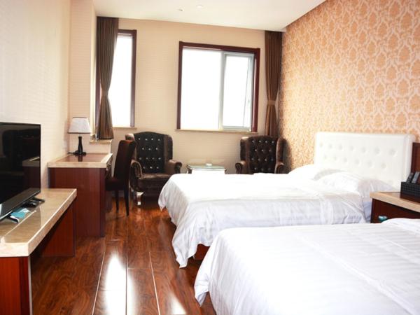 Hua Qi Kaiserdom Hotel Zhongshan Road St Michael's Cathedral and Zhanqiao Pier Qingdao : photo 2 de la chambre chambre familiale deluxe