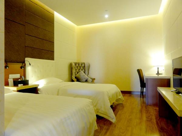 Hua Qi Kaiserdom Hotel Zhongshan Road St Michael's Cathedral and Zhanqiao Pier Qingdao : photo 1 de la chambre chambre lits jumeaux Économique sans fenêtre