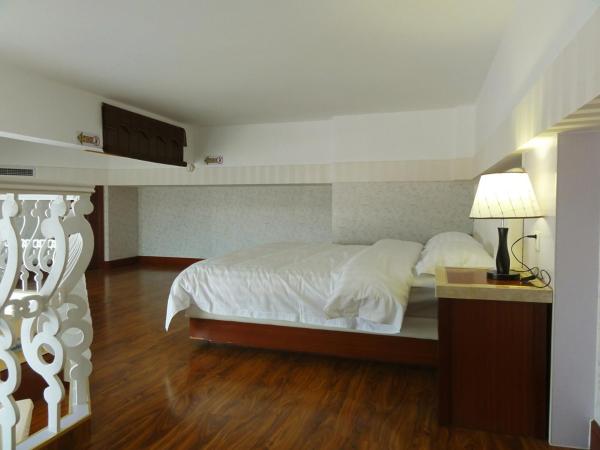 Hua Qi Kaiserdom Hotel Zhongshan Road St Michael's Cathedral and Zhanqiao Pier Qingdao : photo 7 de la chambre suite en duplex