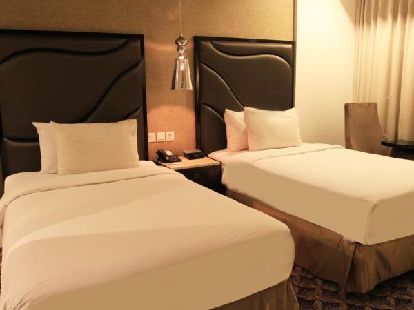 Aston Bellevue Radio Dalam : photo 1 de la chambre chambre lits jumeaux deluxe