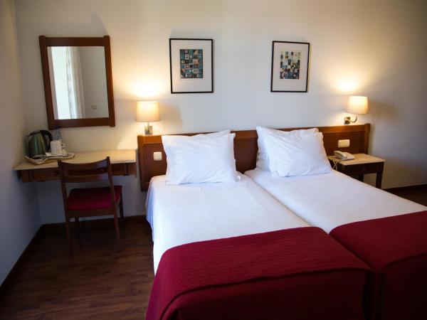 Hotel Solaris : photo 2 de la chambre chambre lits jumeaux - vue sur jardin