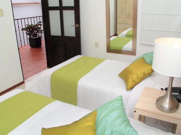 Hotel La Casa de María : photo 3 de la chambre chambre double avec 2 lits doubles