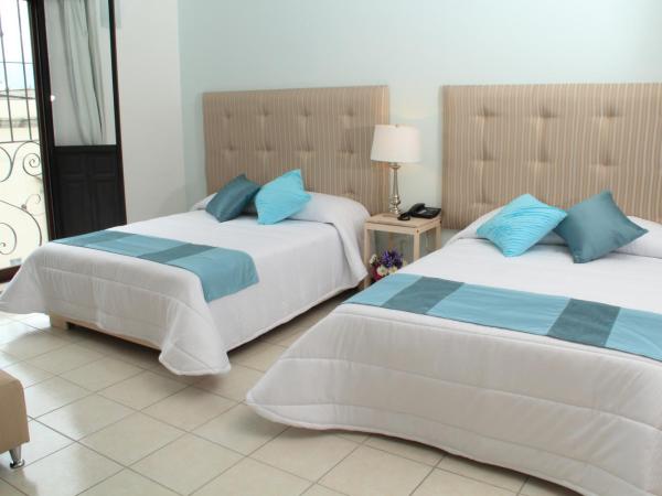 Hotel La Casa de María : photo 2 de la chambre chambre double avec 2 lits doubles