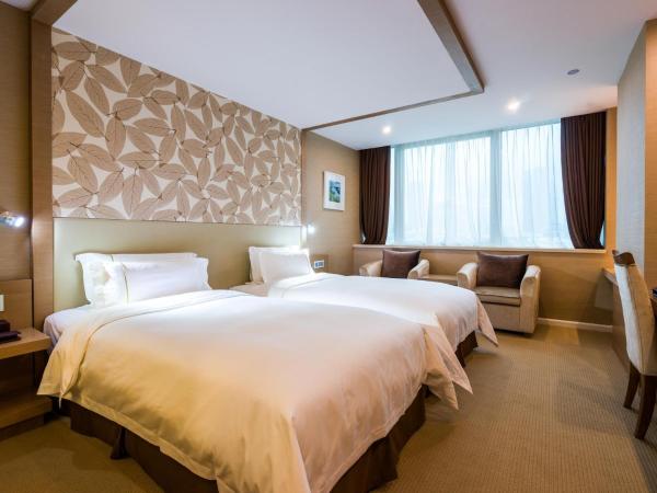 China Mayors Plaza - Free shuttle between hotel and Exhibition Center during Canton Fair : photo 2 de la chambre chambre lits jumeaux exécutive