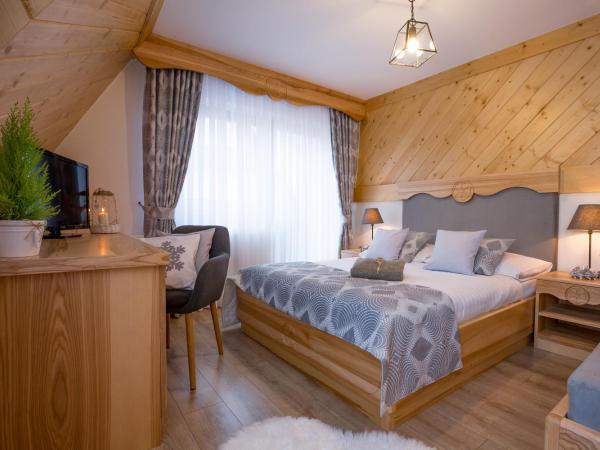 Willa Góralsko Riwiera : photo 1 de la chambre chambre triple deluxe