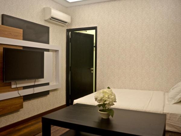 Iconic Suites & Pods Hotel : photo 1 de la chambre suite familiale