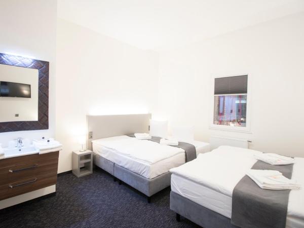 Narodni Stay : photo 3 de la chambre chambre quadruple deluxe - vue sur atrium