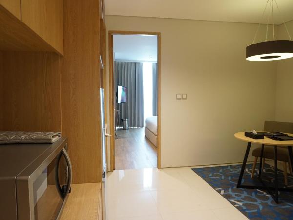 Midtown Residence Surabaya : photo 4 de la chambre fabuleux hébergement lit king-size