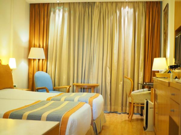 Dia Park Premier : photo 1 de la chambre hébergement lits jumeaux de luxe - non-fumeurs