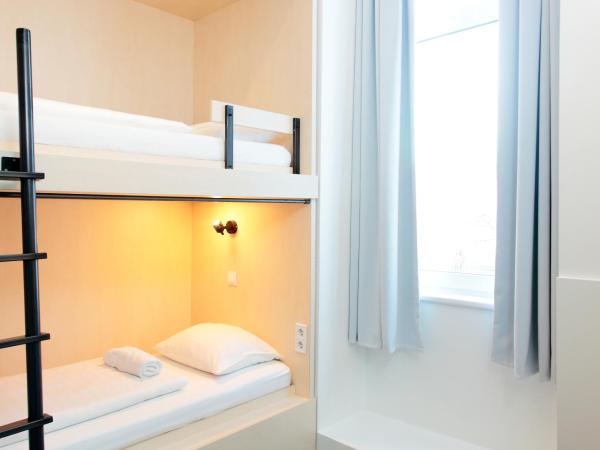 Maverick City Lodge : photo 1 de la chambre chambre lits jumeaux avec salle de bains privative