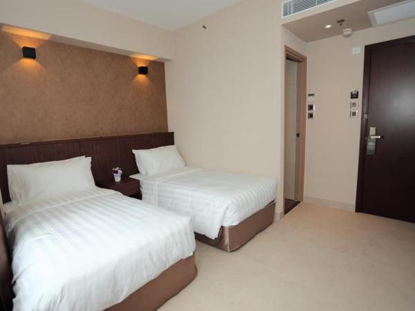 WE Hotel : photo 5 de la chambre chambre lits jumeaux - vue sur ville