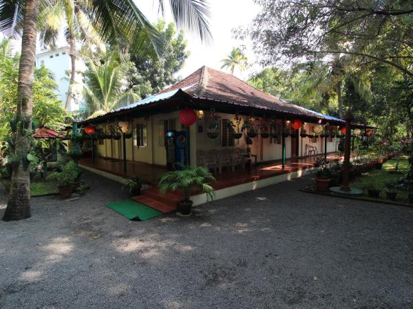 Palm Grove Service Villa : photo 2 de la chambre chambre double standard avec ventilateur