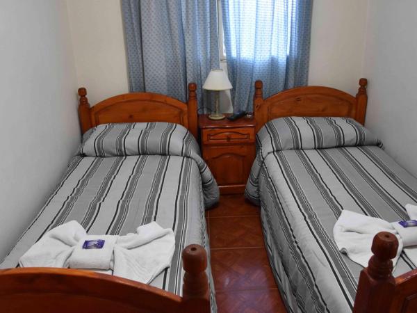 Residencial El Hogar : photo 6 de la chambre chambre lits jumeaux