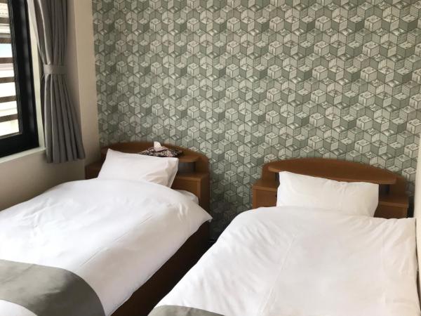 Guest House Rice Chikko : photo 5 de la chambre triple room with shared bathroom and city view 205