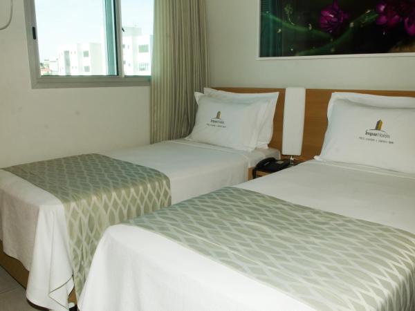 Ímpar Suítes Cidade Nova : photo 1 de la chambre appartement 1 chambre avec 2 lits simples