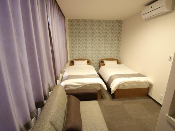 Guest House Rice Chikko : photo 6 de la chambre triple room with shared bathroom and city view 205
