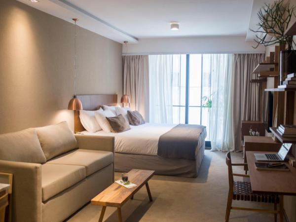AQ Tailored Suites : photo 7 de la chambre suite deluxe avec lit king-size