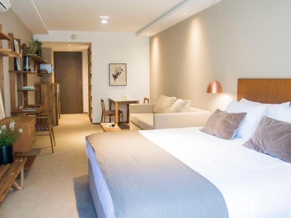 AQ Tailored Suites : photo 6 de la chambre suite deluxe avec lit king-size