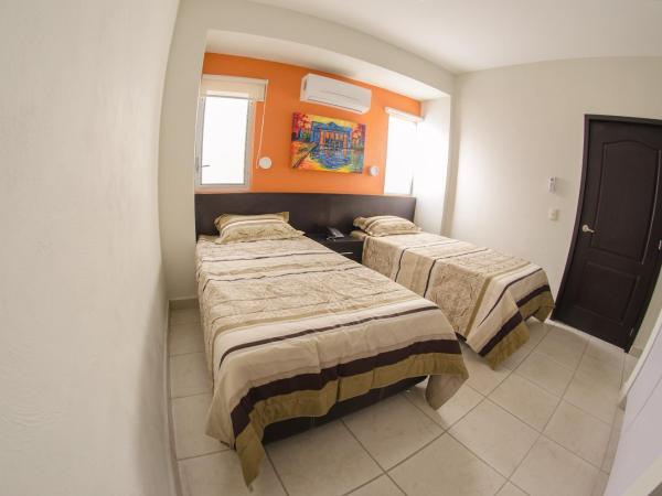 Hotel Belisario INN : photo 6 de la chambre chambre triple