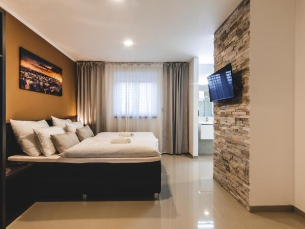 SILESIA Residence : photo 5 de la chambre suite deluxe avec lit king-size