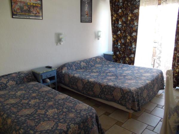 Hôtel Les Alizés : photo 4 de la chambre chambre triple - vue sur jardin