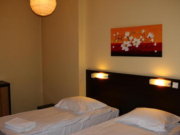 Amicus Żoliborz : photo 2 de la chambre chambre quadruple