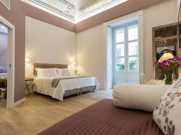 Bellaroto Suite & SPA : photo 1 de la chambre chambre familiale avec balcon
